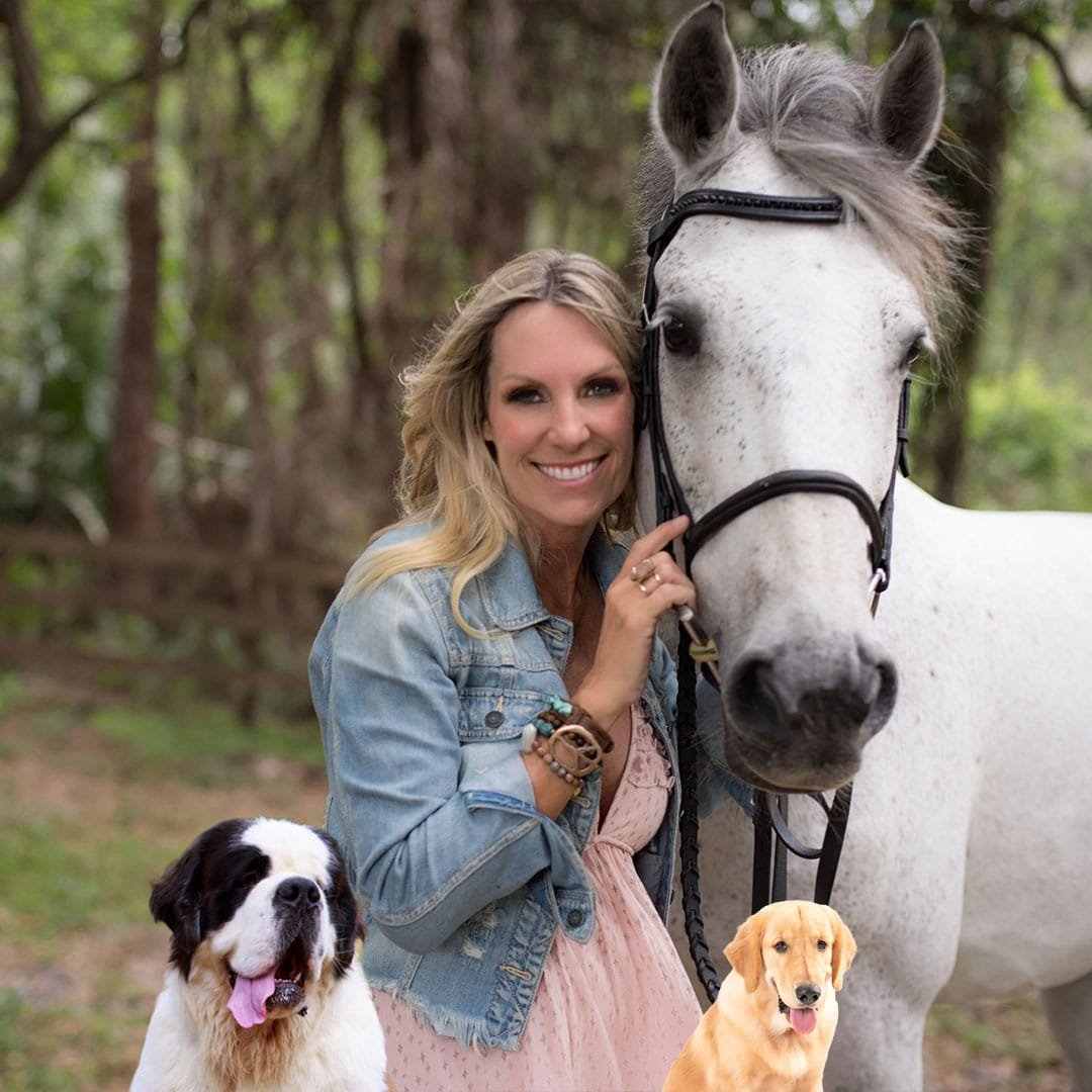 Vickie Miller with dogs and horse