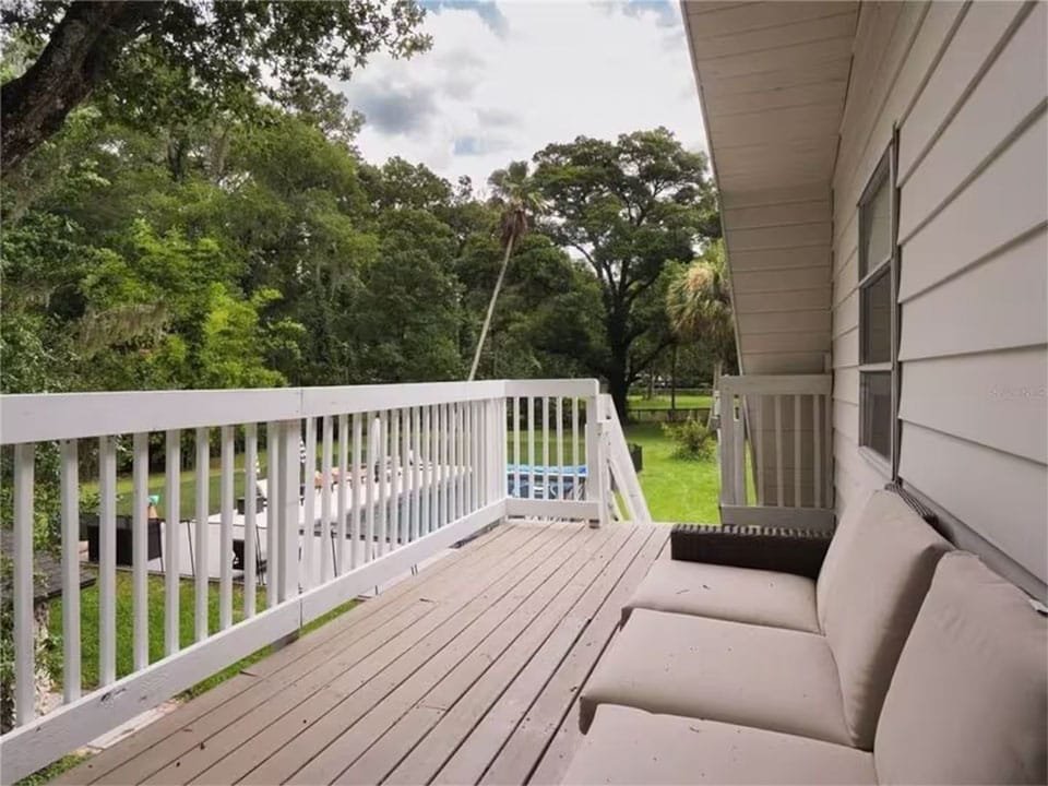 Ocala-Retreat-home-upstairs-deck-pool-960x720